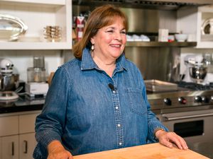 Ina Garten in a kitchen, standing near a counter