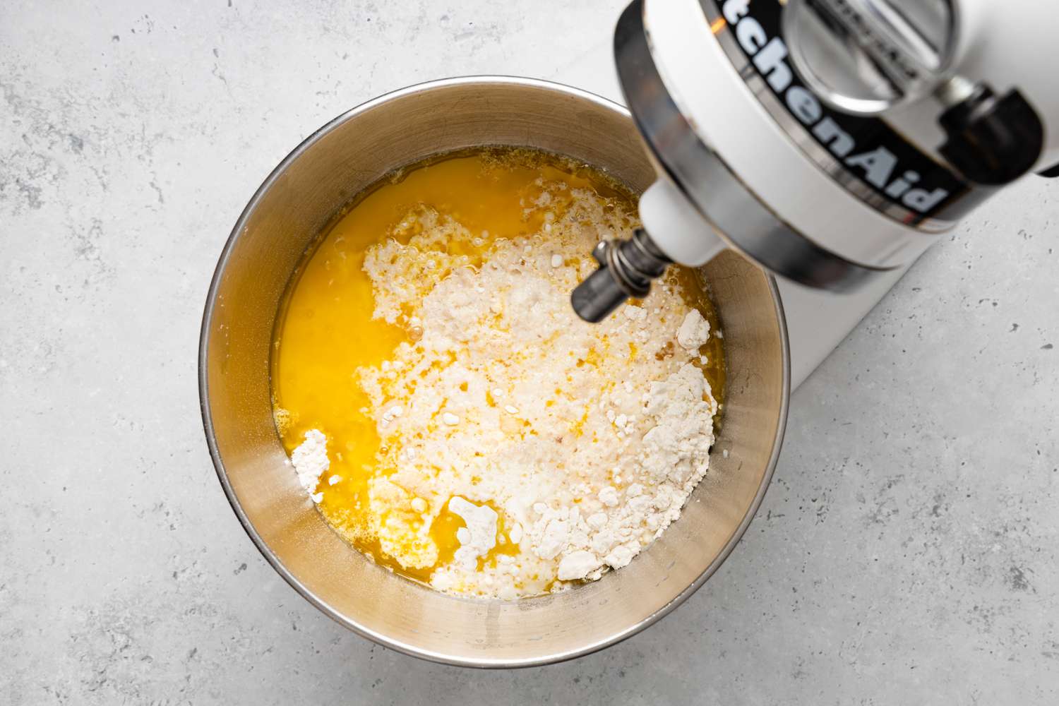 Dough Ingredients (Wet and Dry) Added to Stand Mixer with Dough Hook for Donuts Recipe