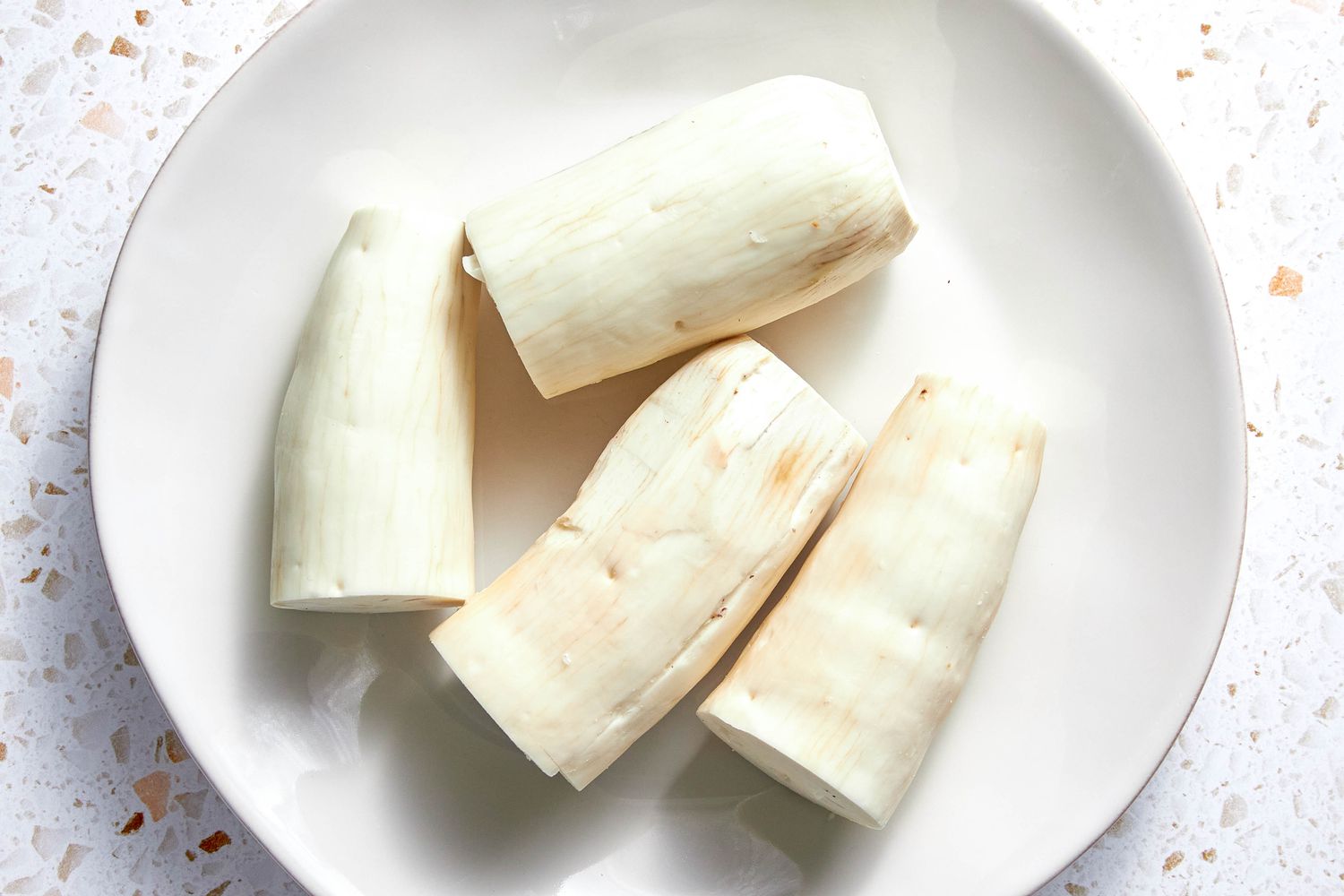 Peeled Yuca Roots on a Plate for Yuca Fries Recipe 