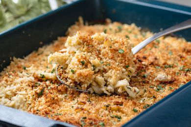Serving turkey noodle casserole from a baking dish