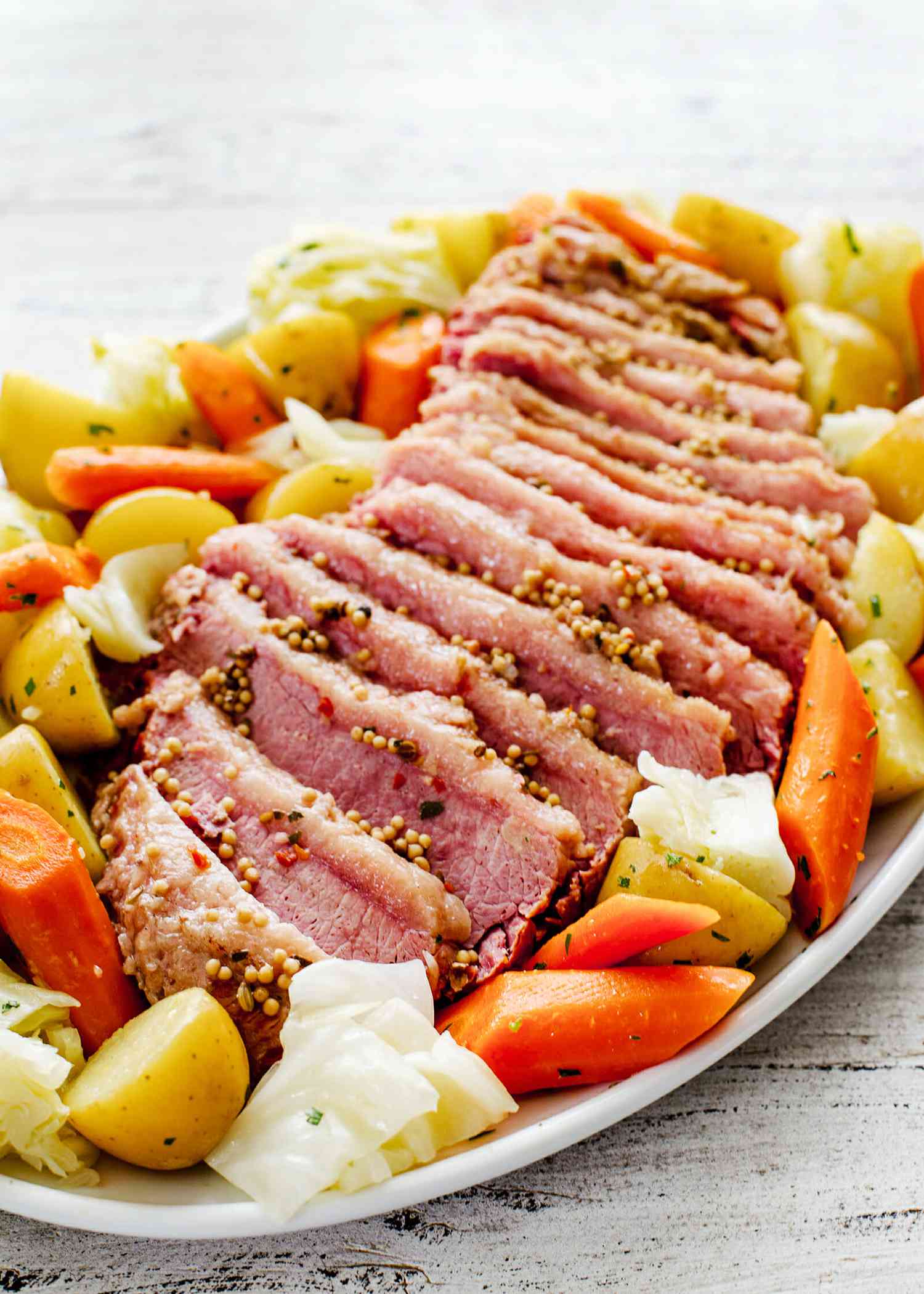 Corned Beef and Cabbage Recipe - corned beef, cabbage, potato, carrots on platter