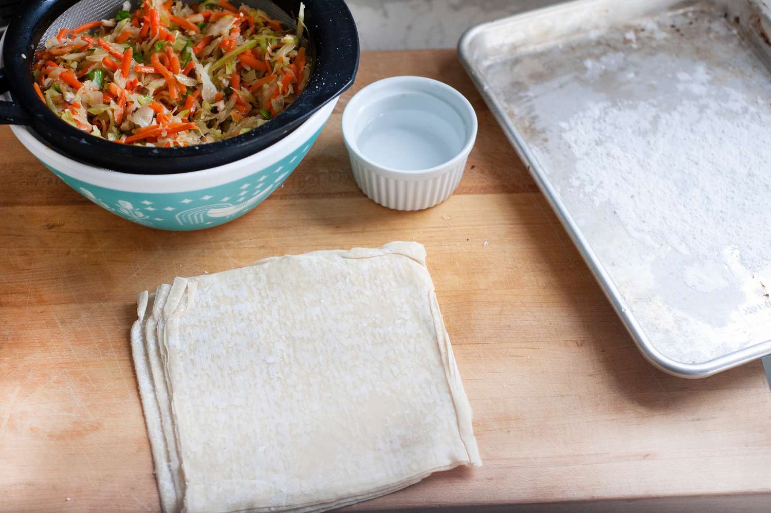Filling and wrappers for deep fried egg rolls.