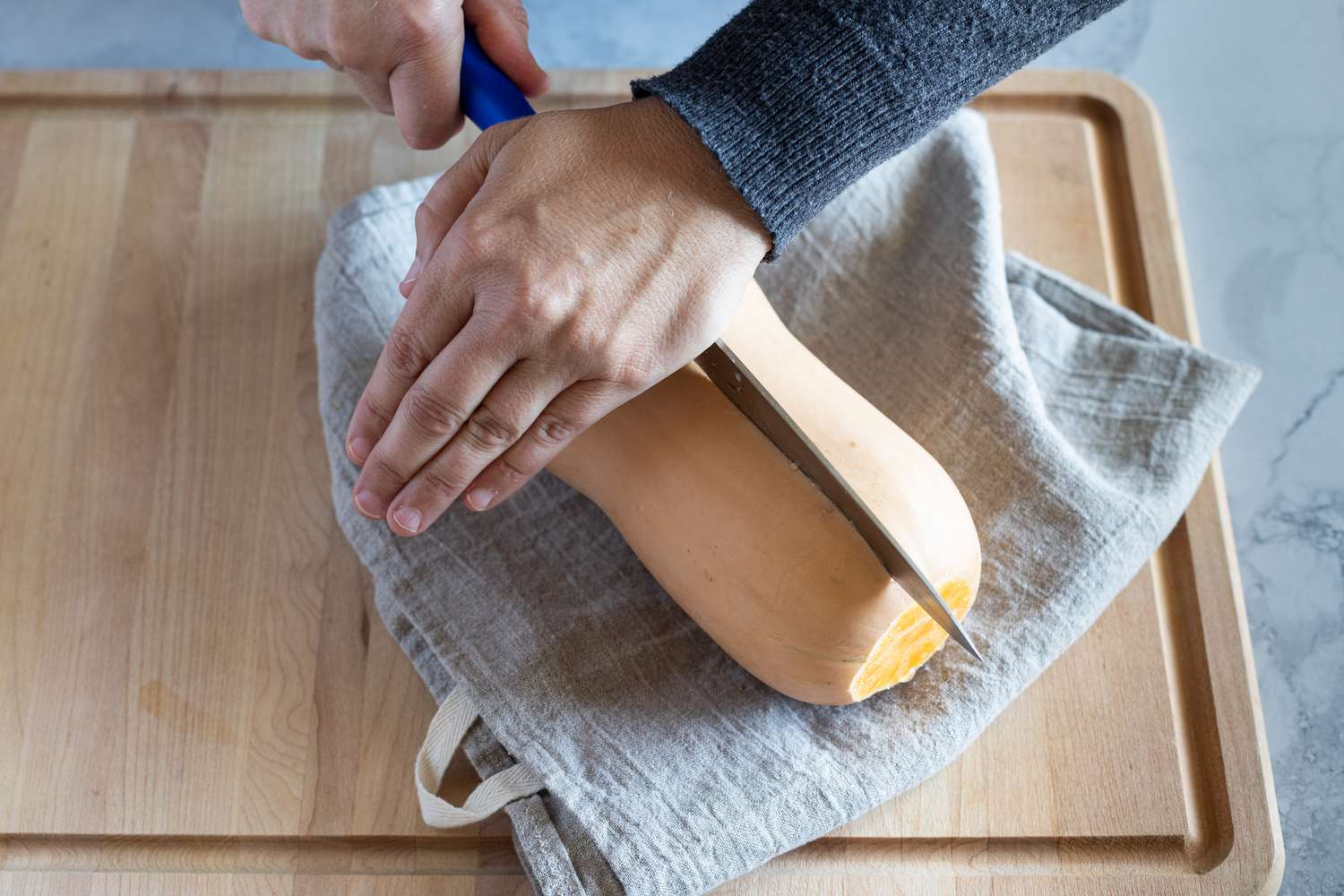 Cutting a squash from end to end in half