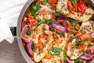 Chicken Recipe in Skillet with Italian Seasonings-close up of chicken and vegetables in a silver skillet